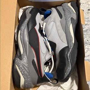 Puma “Thunder Electric” Stylish Black and Gray Sneakers with Red Accents